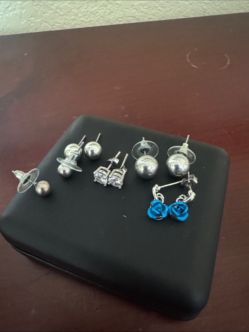 Sterling Silver Earrings Set with Blue Rose Accent